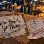 Restaurant iqra metz : affiche Iqra Snack et Pizza sur boîte carton